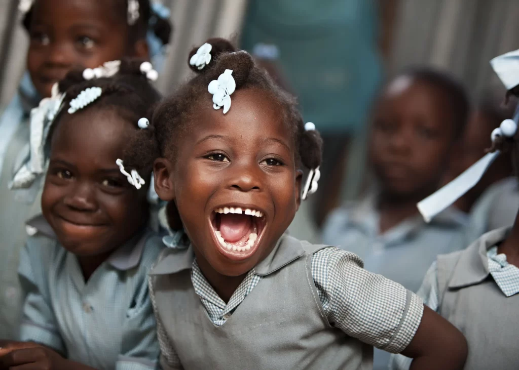 smiling Haiti girl at aschool happy